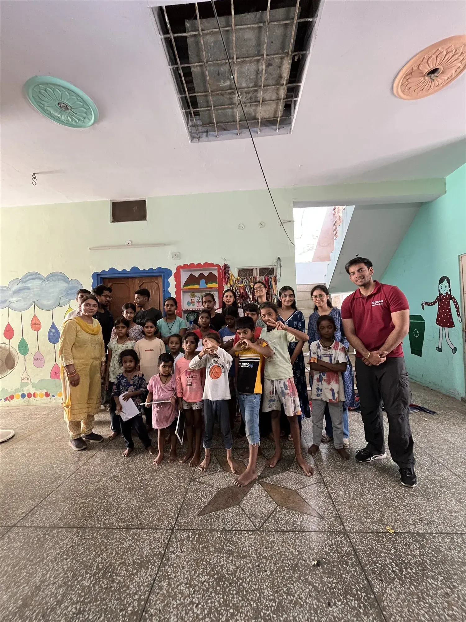 The Aignosis team with children at a community screening drive